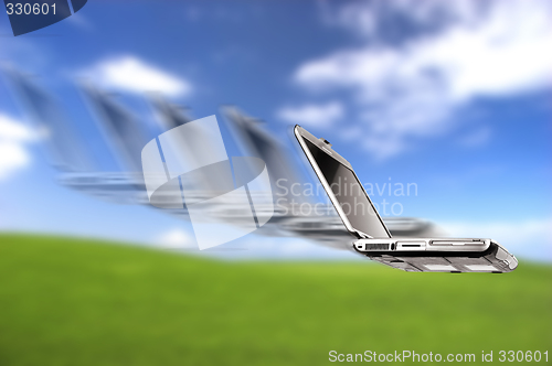 Image of Laptop flying