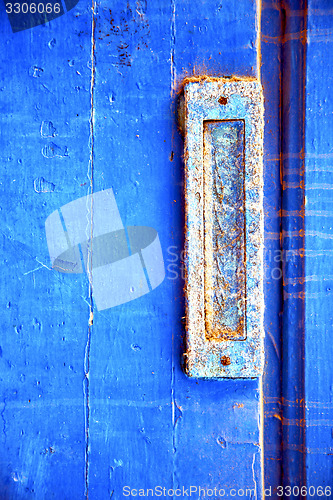 Image of dirty stripped paint in  mail box