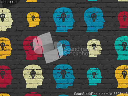 Image of Information concept: Head With Light Bulb icons on wall background