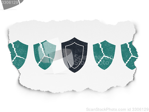 Image of Privacy concept: shield icon on Torn Paper background