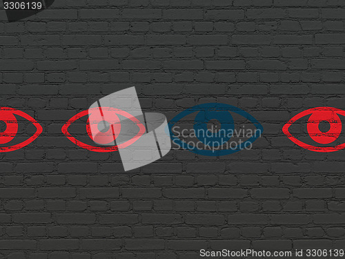 Image of Security concept: eye icon on wall background