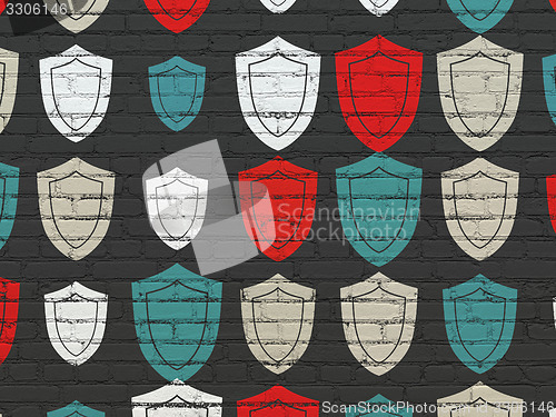 Image of Security concept: Shield icons on wall background