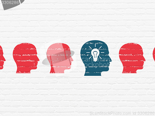 Image of Finance concept: head with light bulb icon on wall background