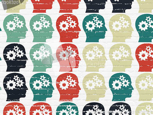 Image of Finance concept: Head With Gears icons on wall background