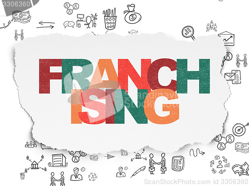 Image of Business concept: Franchising on Torn Paper background