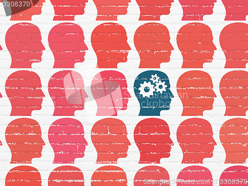 Image of Business concept: head with gears icon on wall background