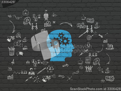 Image of Finance concept: Head With Gears on wall background