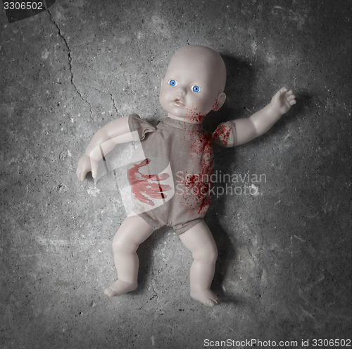 Image of Concept of child abuse - Bloody doll