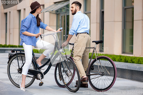 Image of Romantic date of young couple on bicycles