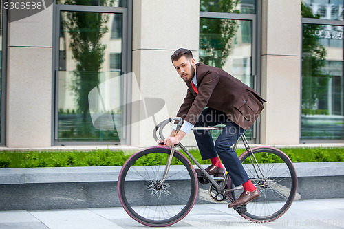 Image of Handsome businessman and his bicycle