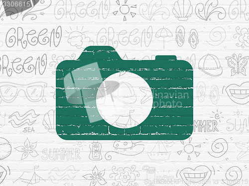 Image of Travel concept: Photo Camera on wall background