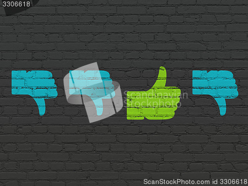 Image of Social media concept: thumb up icon on wall background