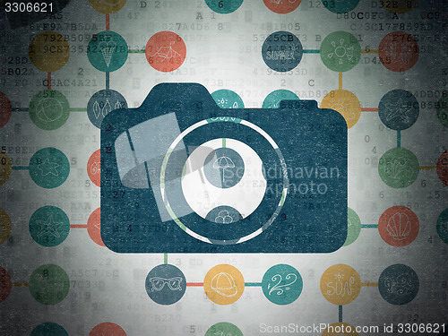 Image of Tourism concept: Photo Camera on Digital Paper background