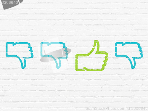 Image of Social network concept: thumb up icon on wall background