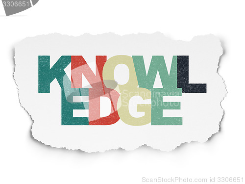 Image of Learning concept: Knowledge on Torn Paper background