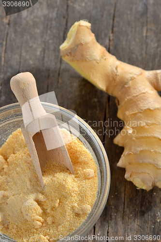 Image of Fresh ginger root and ground ginger spice 