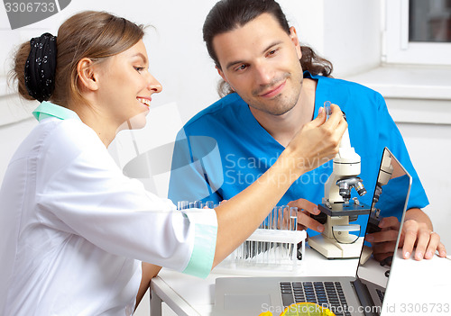 Image of Doctor shows test tube