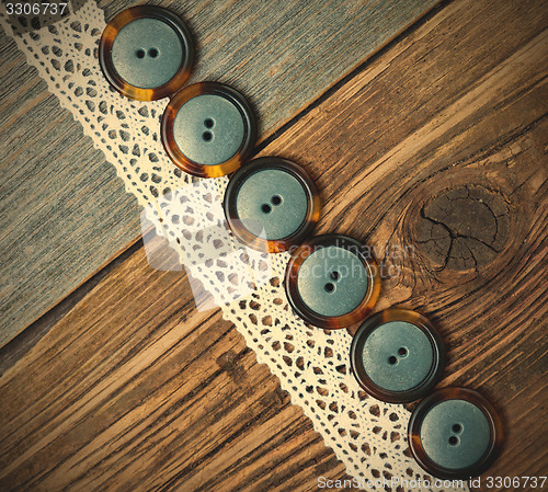 Image of vintage buttons and antique lace