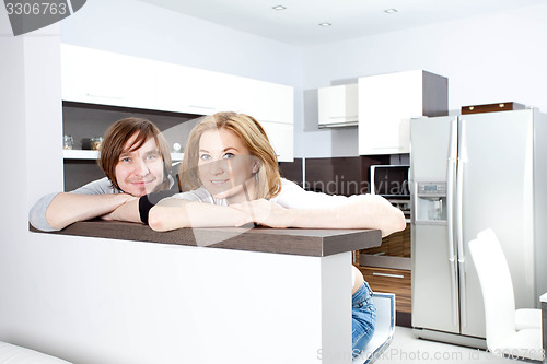 Image of Smiling Couple  In New Home