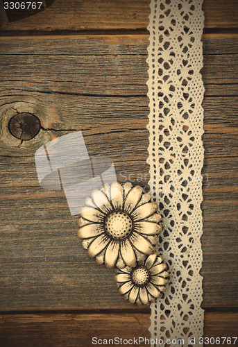 Image of vintage metal buttons flowers and lace ribbons