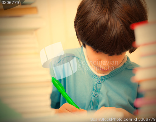 Image of schoolboy doing homework