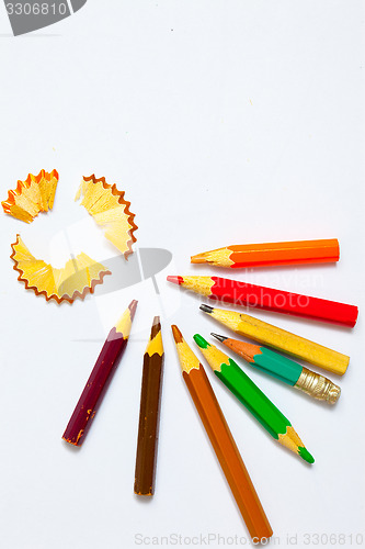Image of set of a old colored pencils with shavings