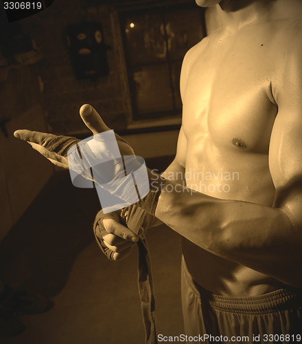 Image of fighter prepares hands for sparring