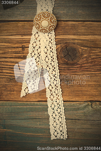 Image of vintage lace with a brooch