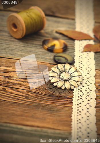 Image of vintage buttons with lace tape