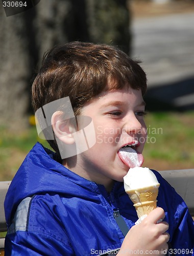 Image of Boy licking ice cream
