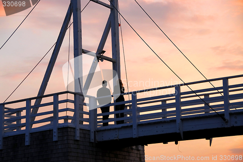 Image of Couple watching sunset