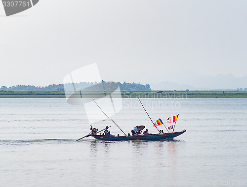 Image of Boat with Buddhist flags in Myanmar