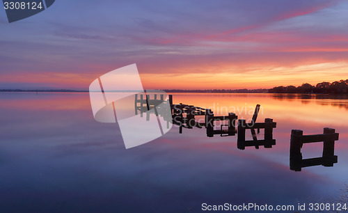 Image of Serene water and stunning sunrise at Gorokan Jetty Australia