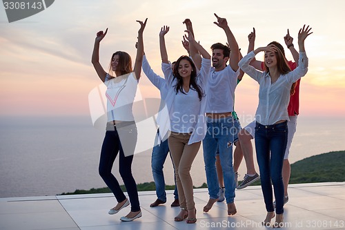 Image of party people  on sunset