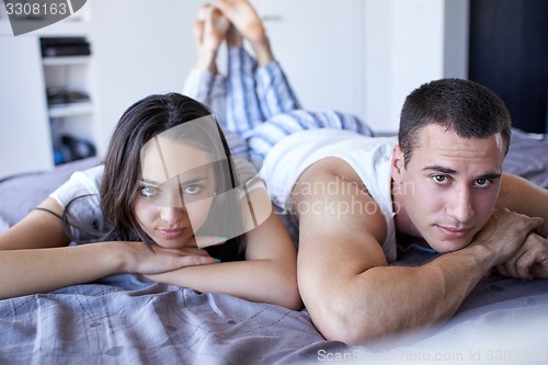 Image of couple relax and have fun in bed