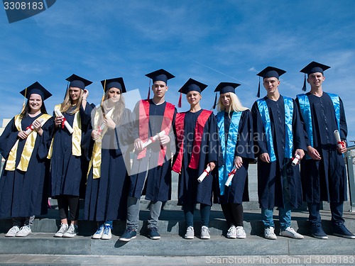 Image of young graduates students group