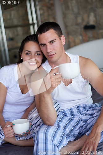 Image of couple relax and have fun in bed