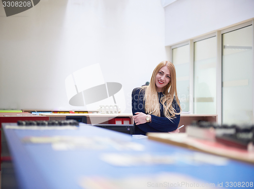 Image of business woman working on computer at office