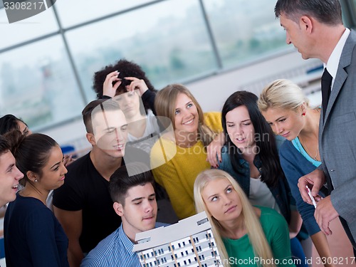 Image of students with teacher  in computer lab classrom