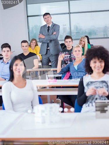 Image of students with teacher  in computer lab classrom