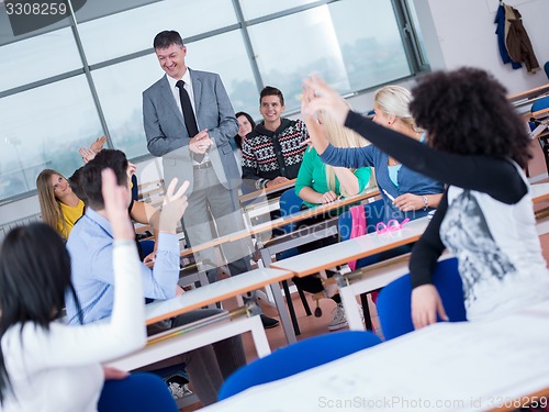 Image of students with teacher  in computer lab classrom