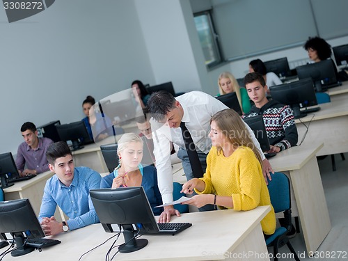 Image of students with teacher  in computer lab classrom