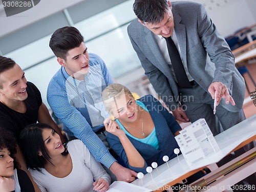 Image of students with teacher  in computer lab classrom