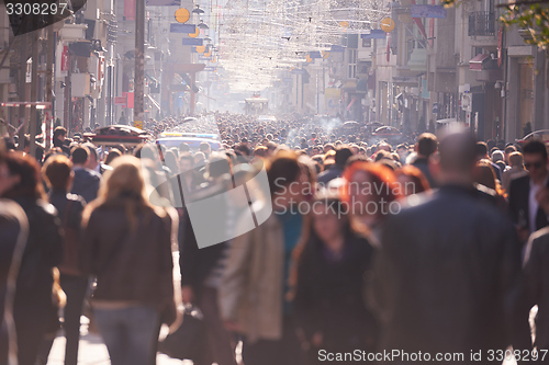 Image of people crowd walking on street