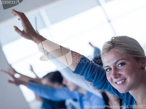 Image of students group raise hands up