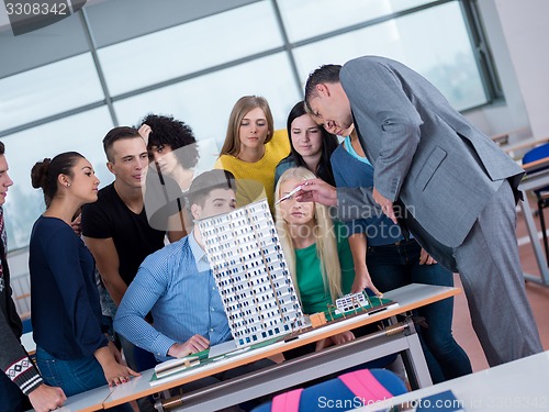 Image of students with teacher  in computer lab classrom