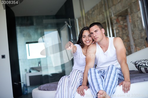 Image of couple relax and have fun in bed