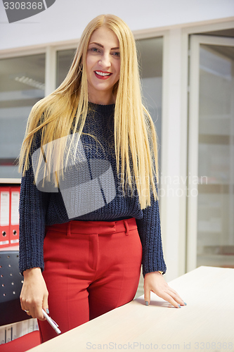 Image of business woman working on computer at office