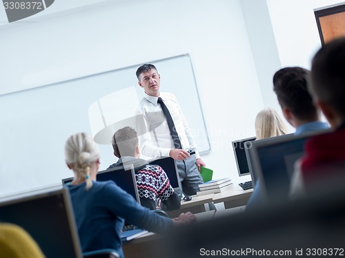 Image of students with teacher  in computer lab classrom