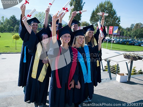 Image of young graduates students group